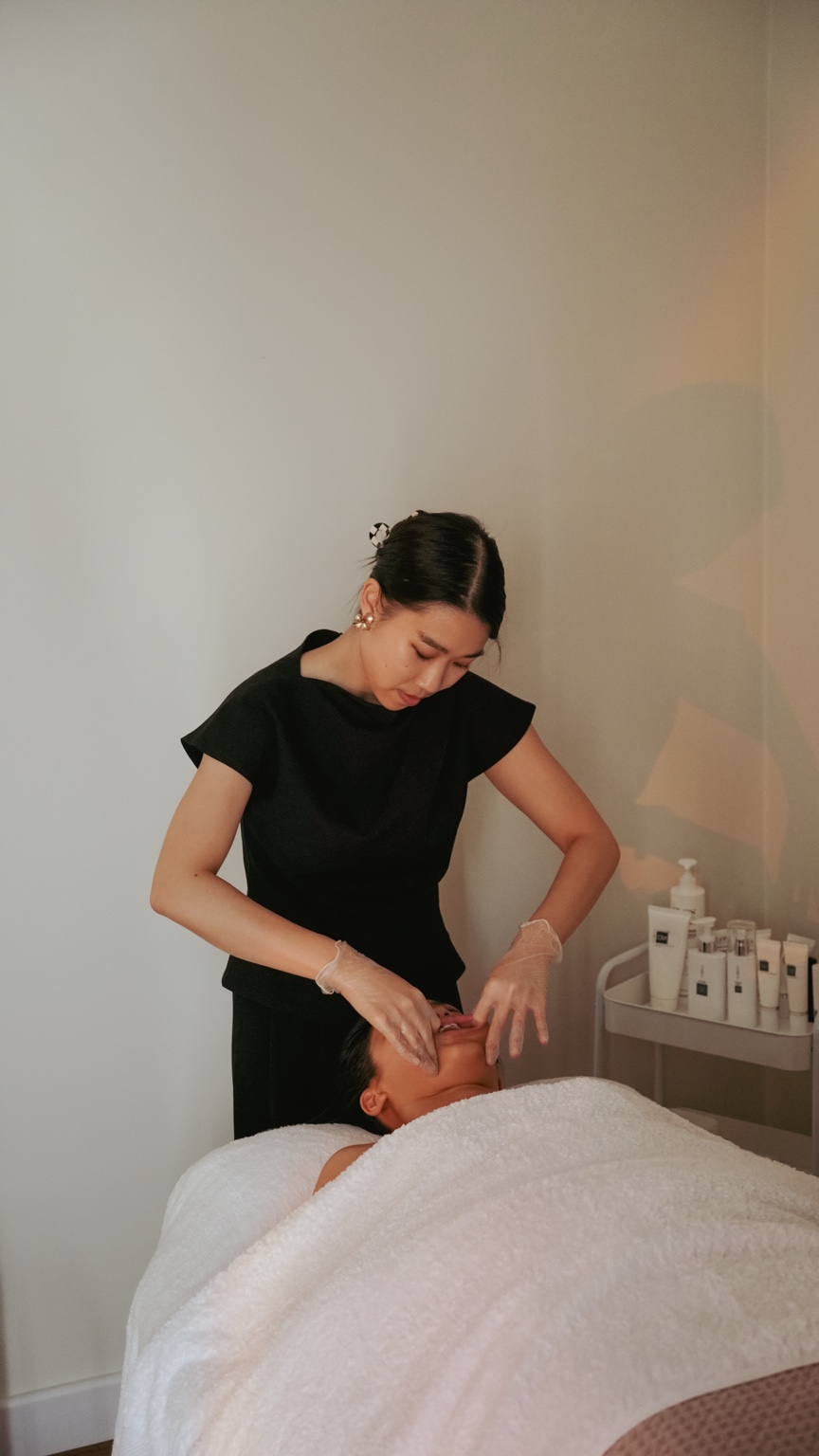 MUKA specialist performing the signature facial treatment